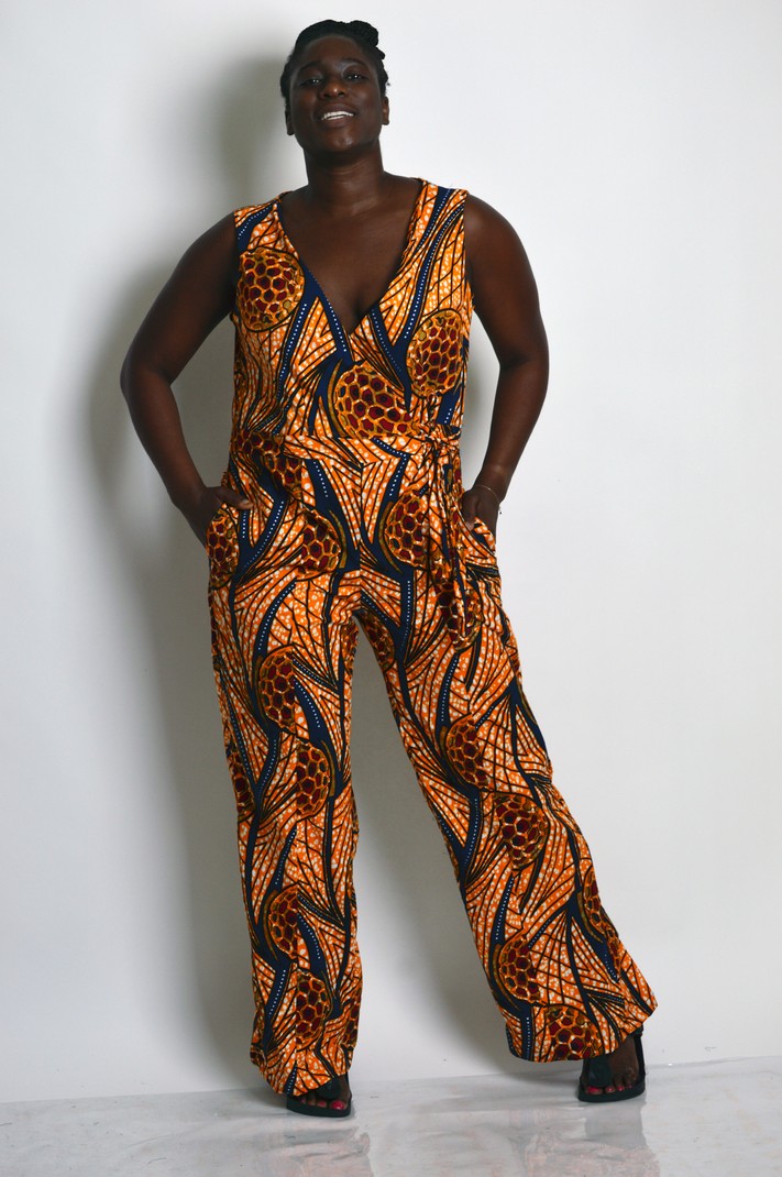 orange ankara jumpsuit with v neck and zipper front and side pockets