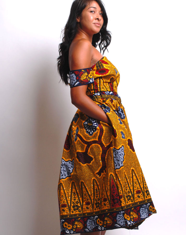 gold and black african print midi skirt and off shoulder crop top