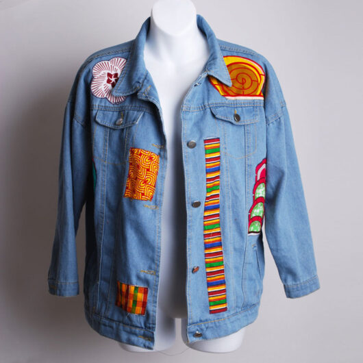 light blue jeans jacket with african print patches
