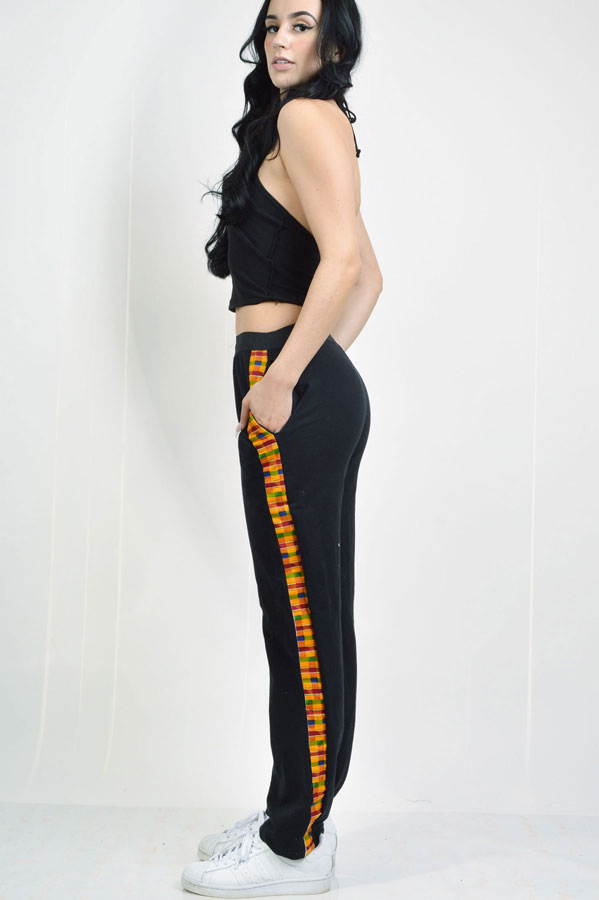 black knit jersey pants with elastic waist and kente strip on the sides