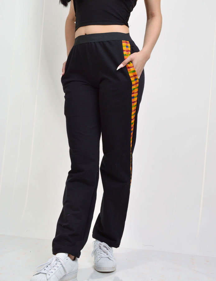 black knit jersey pants with kente strips on the sides