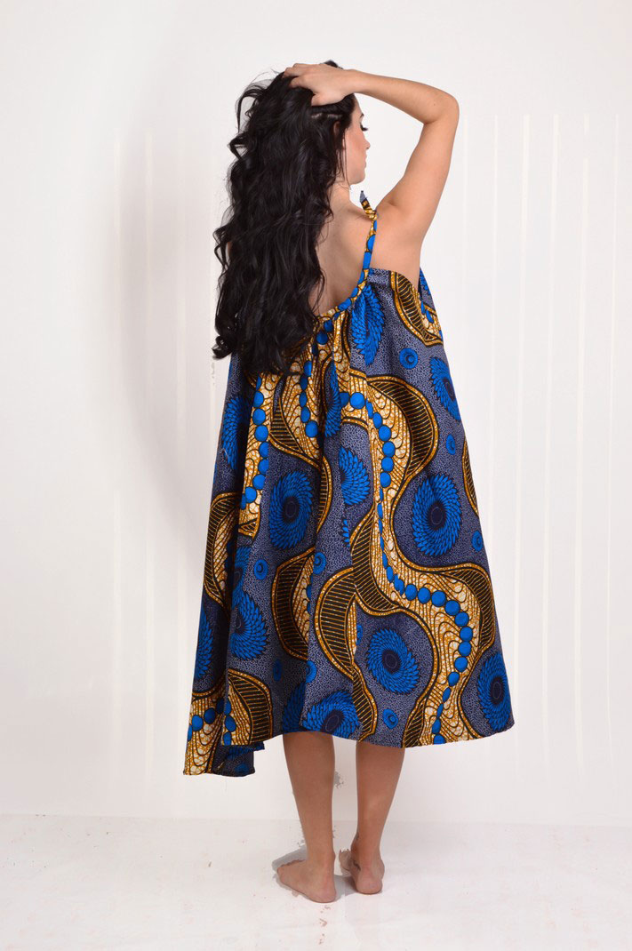 back view of blue and tan african print midi flare dress with adjustable straps