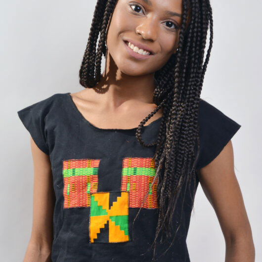 casual black knit jersey round neck inset sleeves crop top with patches of kente on the front