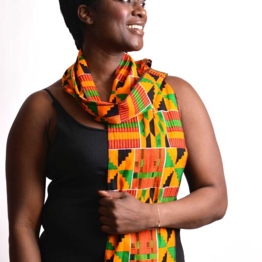 woman wearing african kente scarf smiling