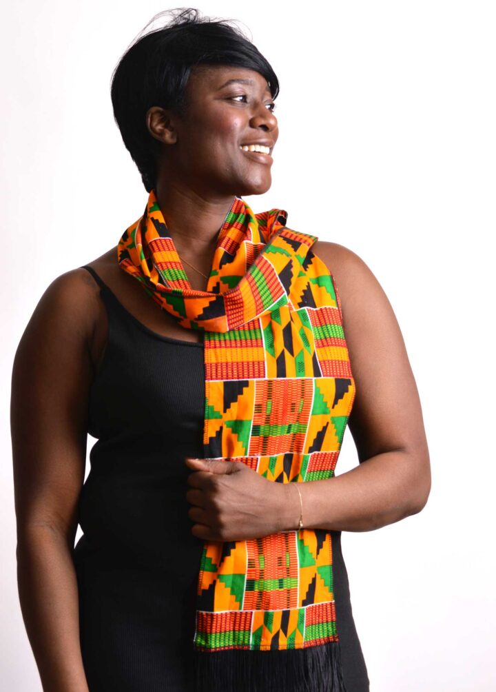 woman wearing african kente scarf smiling