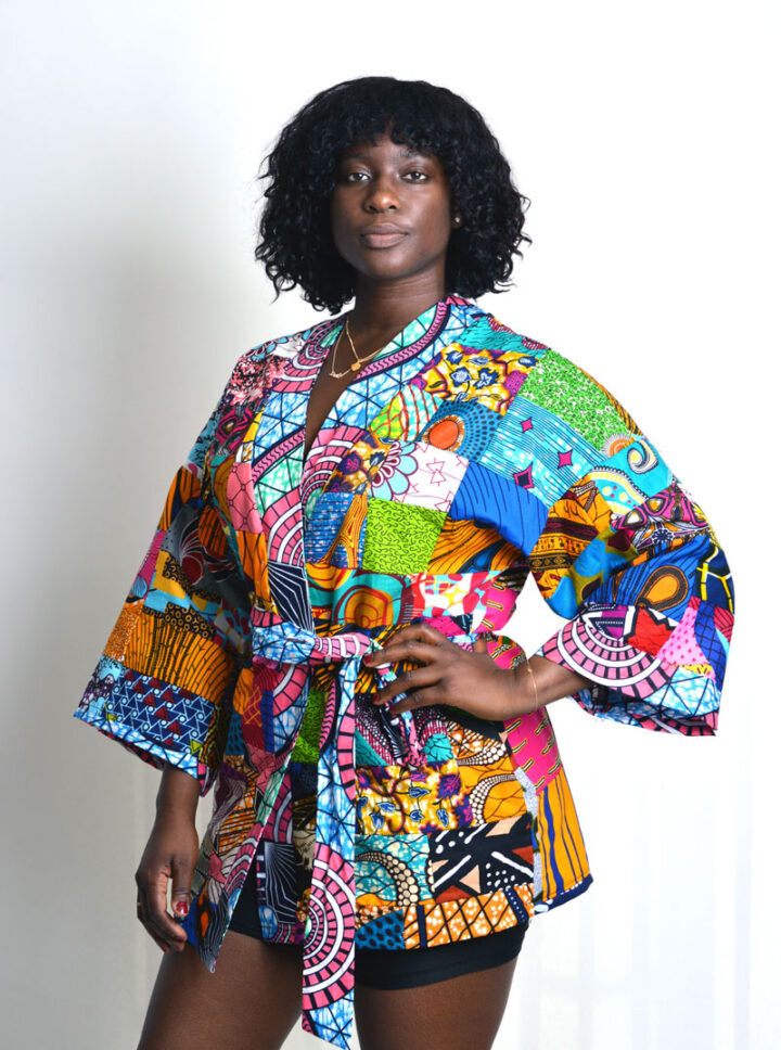 model wearing a patchwork kimono with wide sleeves and belt