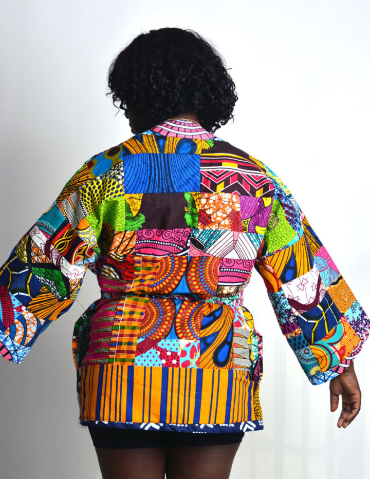 back view of a kimono dress made of a patchwork of african print strips