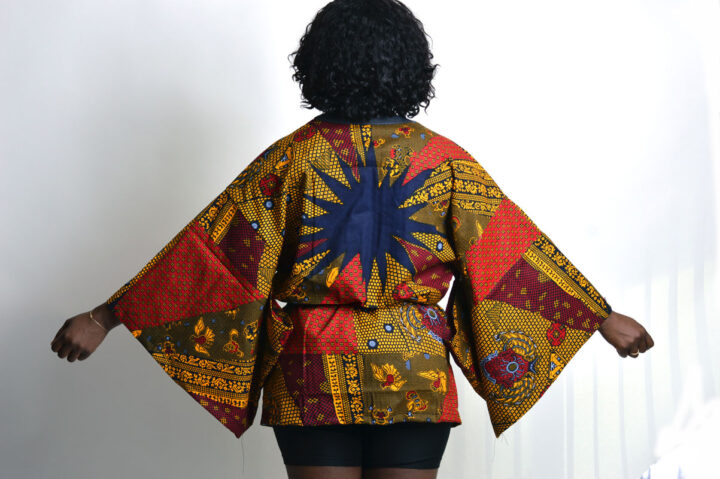 back view of japanese style ankara kimono with wide sleeves and black belt