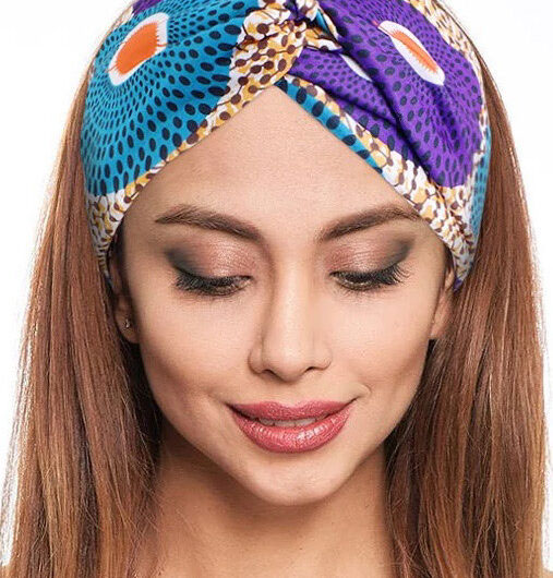 model wearing stretch ankara blue and purple african headband twist style